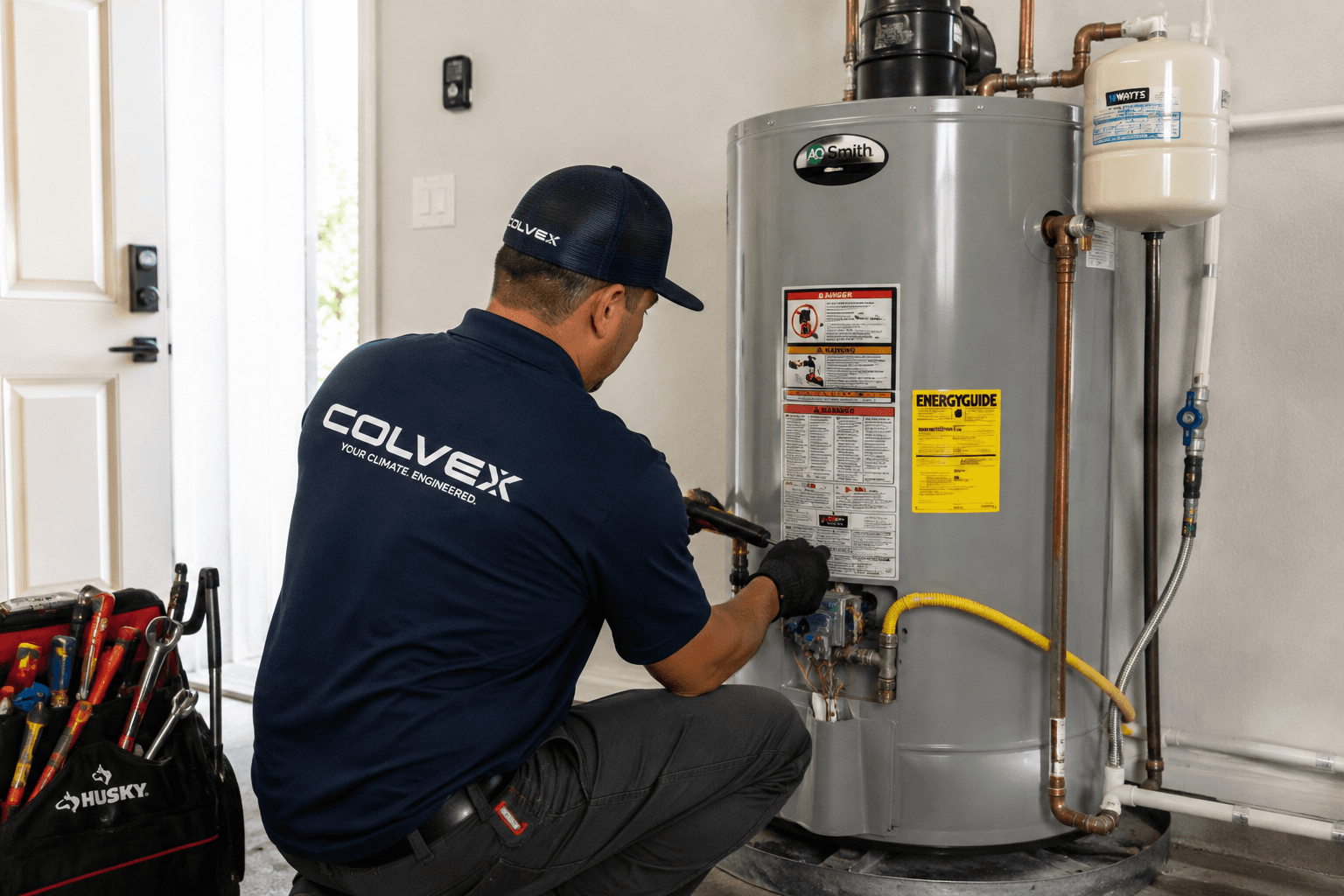 Colvex technician performing water heaters at a DFW home